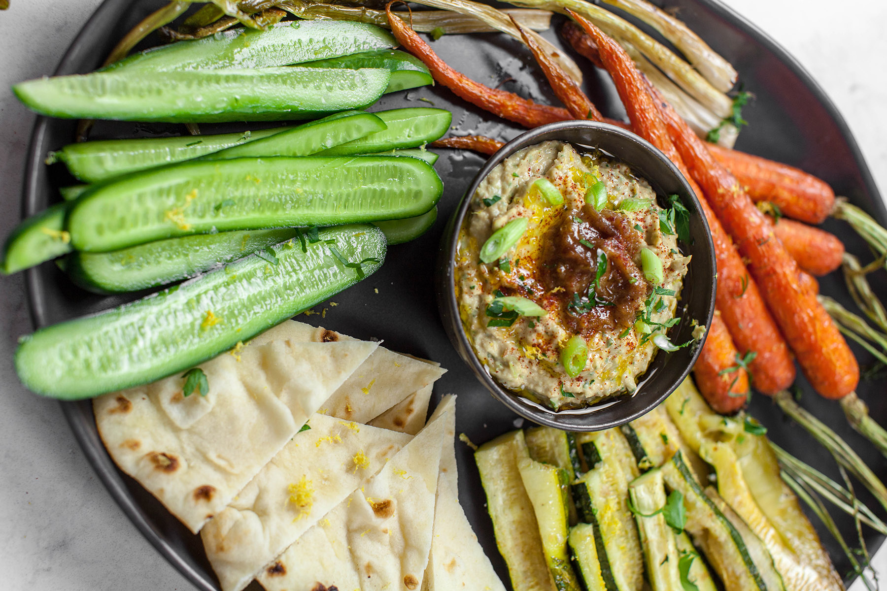 Hummus with spring onion and caramelized onion